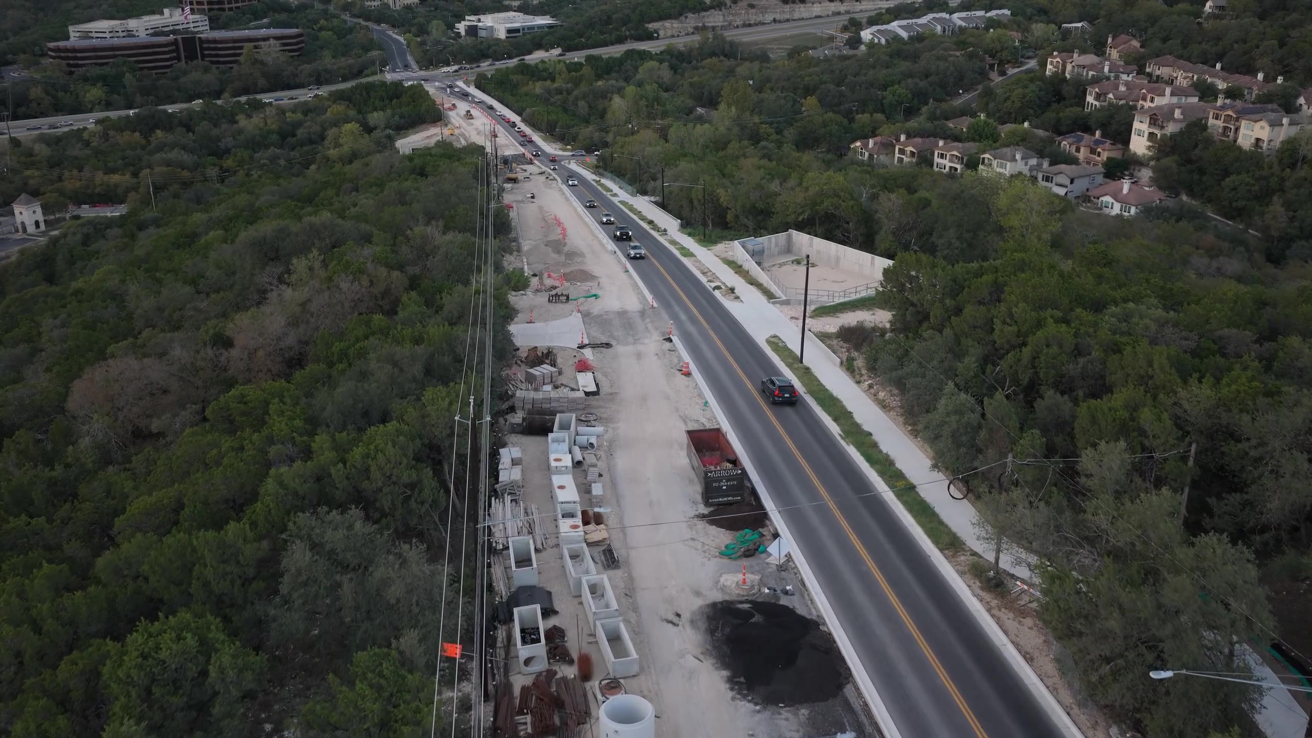 Aerial view of roadway construction and adjacent infrastructure